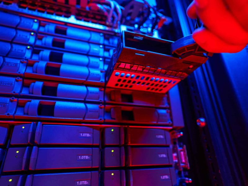 It engineer is disassembling and repairing computer server in data center